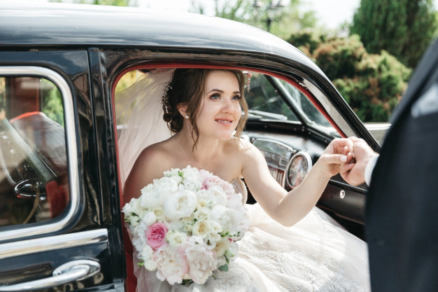 beautiful-bride-comes-out-car_8353-9497