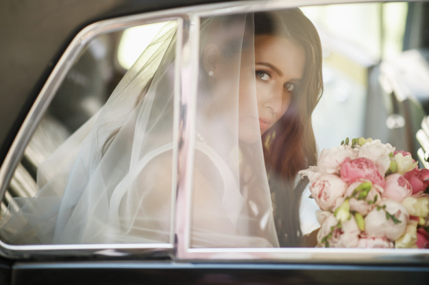 beautiful-bride-sits-with-wedding-bouquet-retro-car-has-fun_8353-7228
