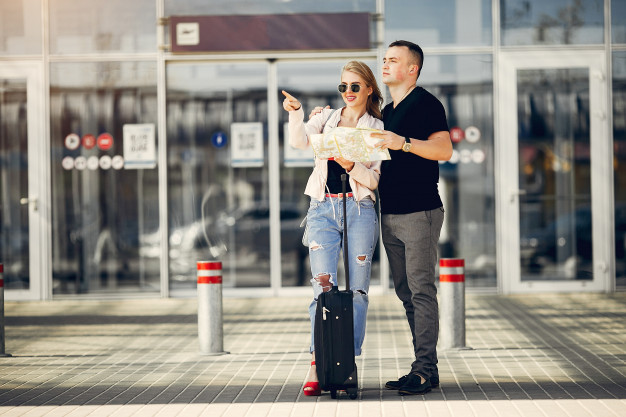 beautiful-couple-standing-airport_1157-22052