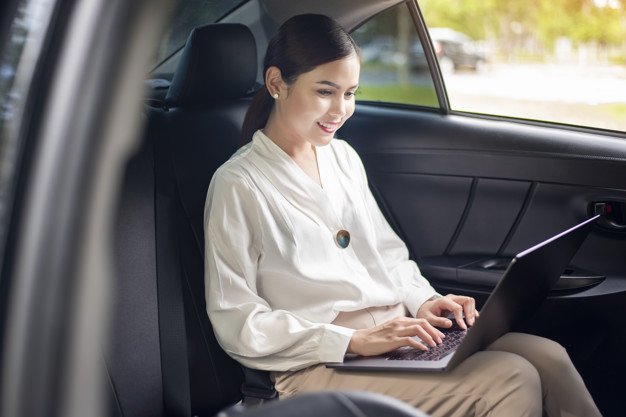 beautiful-business-woman-is-working-in-car