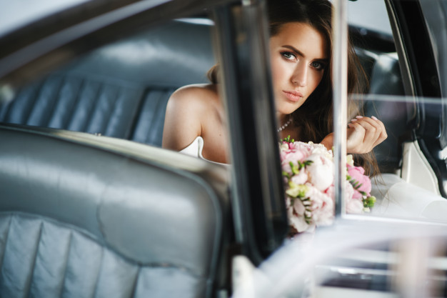 seductive-bride-sits-inside-white-retro-car-with-leather-seats_8353-7250